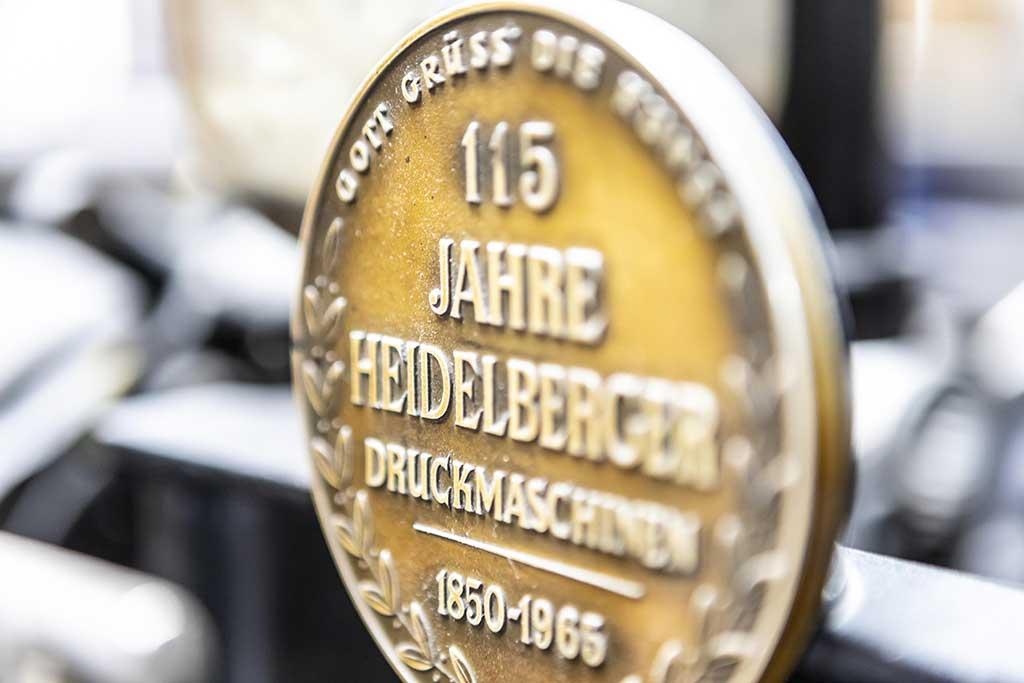 Daneels Media Group 115 Jahre Heidelberger Druckmaschinen embleem